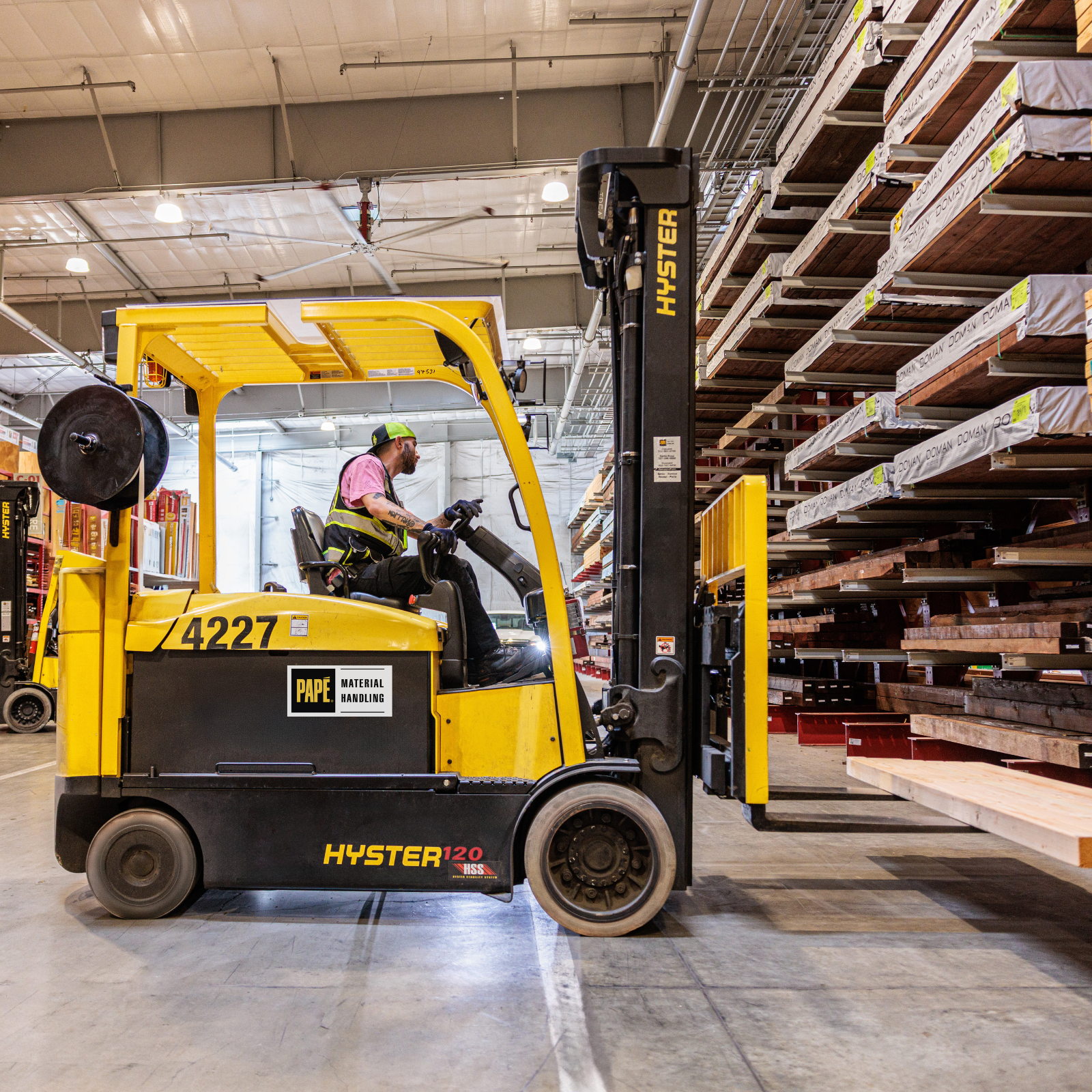 Electric forklifts from Papé Material Handling operating at Golden State Lumber indoor yard.