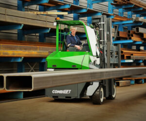 Combilift multi-directional forklift maneuvering long materials through tight warehouse aisles for space optimization
