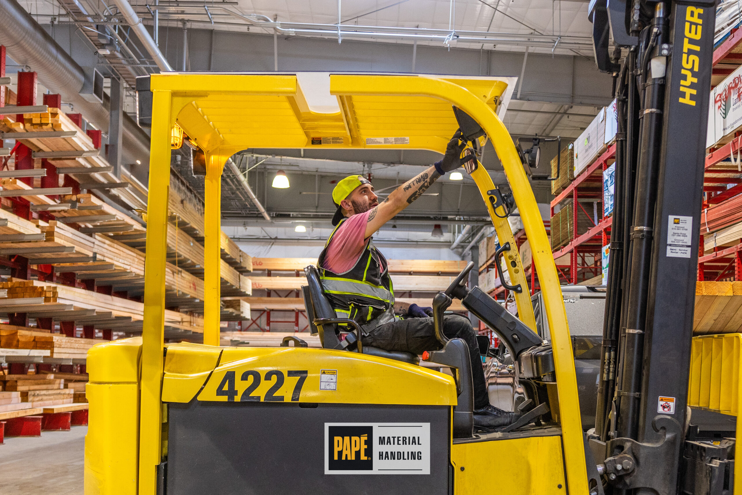 Forklift operating safely around pedestrians in distribution center