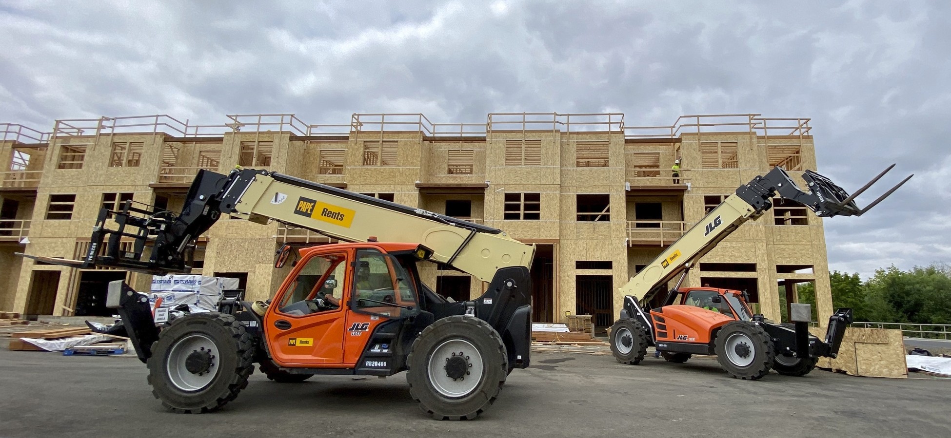 Telehandler being used on a construction site as part of a material handling equipment rental solution