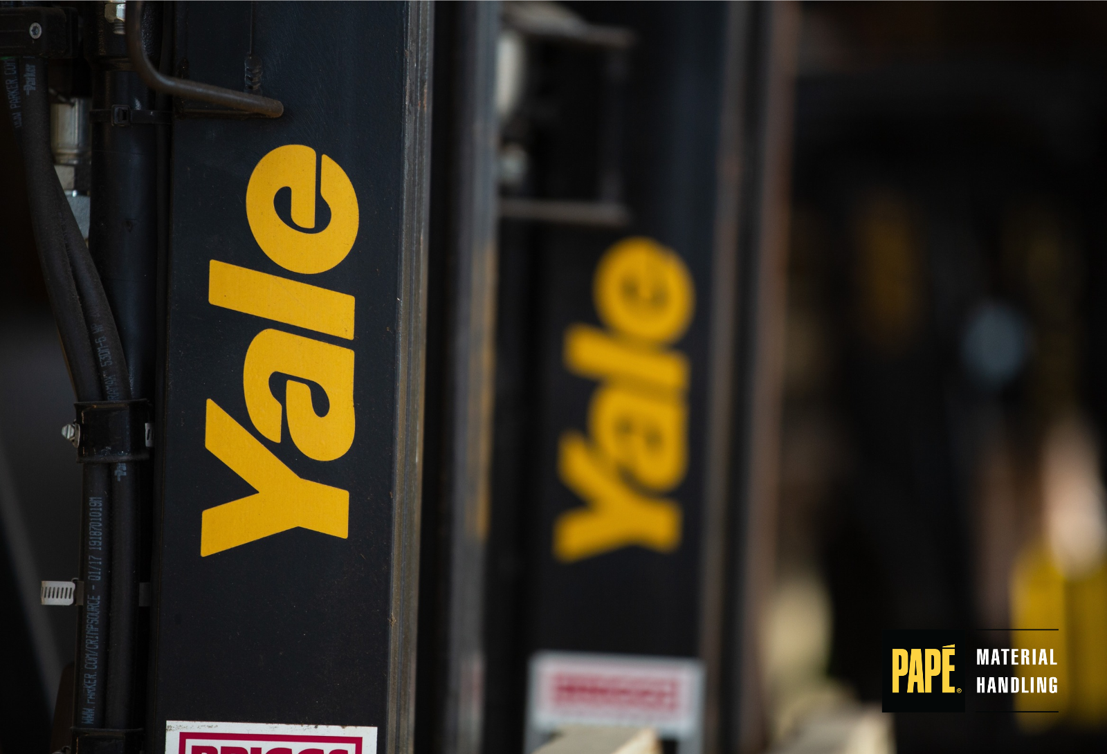 Yale forklift moving palletized building materials at a home improvement center